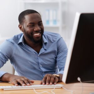 man looking at a computer